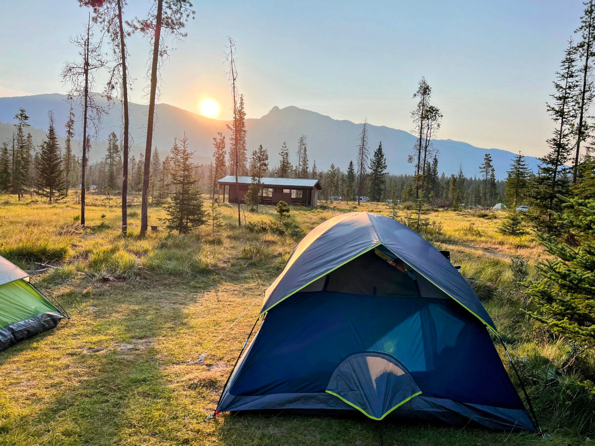 Our tent in Wapiti Campground with sunrise view